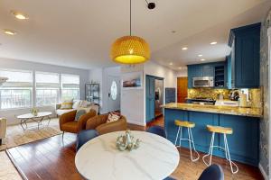 a kitchen and living room with a table and chairs at Dune Delight in Arroyo Grande
