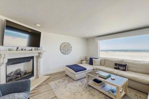 a living room with a couch and a fireplace at Savor the View in Oxnard