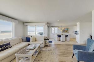 a living room with a couch and a table at Savor the View in Oxnard