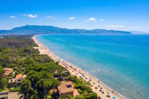 an aerial view of a beach with umbrellas at Casa Giannellina - Happy Rentals in Orbetello