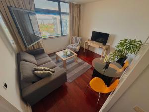 a living room with a couch and a table at Polana View Apartment I in Maputo