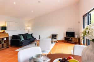 a living room with a couch and a table at Quarry View Studio in Shrewsbury with Parking in Shrewsbury