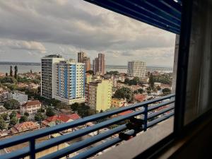 a view of a city from a window of a building at Polana View Apartment I in Maputo