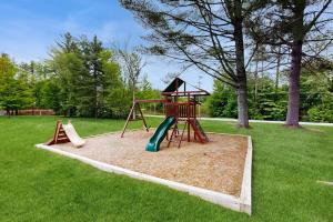 a playground with a slide and a play structure at Charming and casual motel in a great location with shared resort amenities in Lincoln