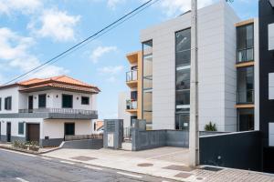 an image of an apartment building on a street at Canhas Ocean View in Ponta do Sol