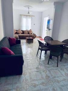 a living room with a couch and a table at شقق قرية النورس in Ismailia