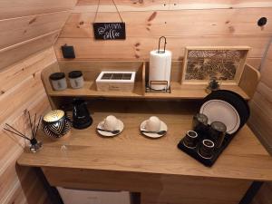a room with a wooden table with dishes on it at Eagle's View Cabin in Plav