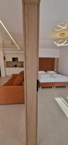 a living room with two beds and a table at Sea Apartments in Łeba +61 photos