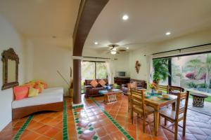 a living room with a couch and a table at Las Palmas Oceanfront Villas and Casitas in Santa Cruz Huatulco