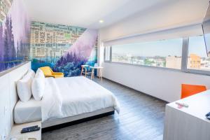 a bedroom with a bed and a large window at Life Hotel in Oaxaca City +19 photos