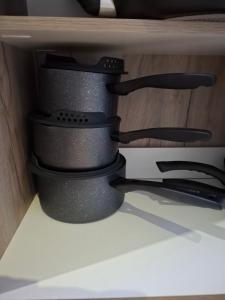 a group of black binoculars sitting on a shelf at The Cosy Nook in Launceston
