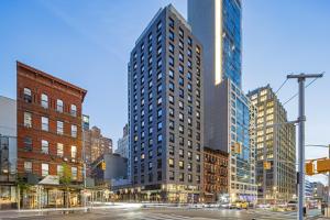 a city intersection with tall buildings in a city at Four Points by Sheraton Manhattan Midtown West in New York