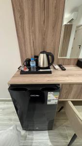 a coffee pot sitting on top of a counter at Qubaa Soul Studio 2-3 in Medina
