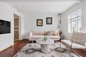 a living room with a couch and a table at The Brown Door in Stavanger