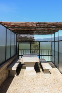 a group of picnic tables on top of a building at Casa da presa in Ponte de Lima
