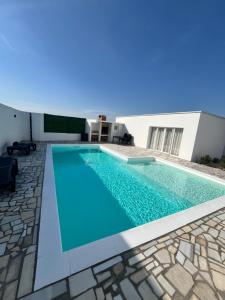 a swimming pool in the middle of a house at Sun&Silence in Mostar