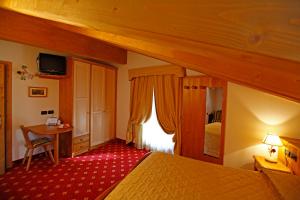 Posteľ alebo postele v izbe v ubytovaní Hotel Il Maniero