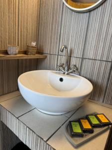 a bathroom with a white bowl sink on a counter at Nostalgia Traditional Home in Skiros +13 photos