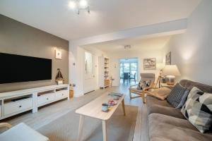 a living room with a couch and a tv at 2 Bed in Portpatrick oc-p43756 in Portpatrick