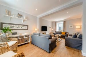 a living room with two couches and a tv at 4 Bed in Portpatrick oc-p43755 in Portpatrick