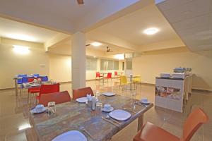 A restaurant or other place to eat at Arra Grande Suites - Nearest Airport Hotels Bangalore