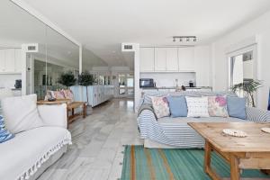 a living room with a couch and a table at Puerto Banus Harbour View Apartment in Marbella