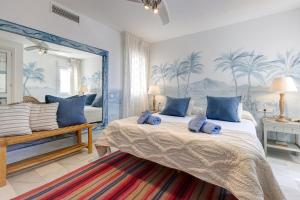 a bedroom with a large bed with a large mirror at Puerto Banus Harbour View Apartment in Marbella