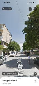 a rendering of a street with cars parked on the road at Fatos in Pogradec