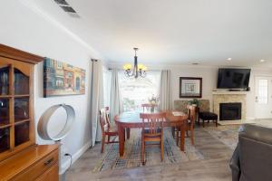 a dining room with a table and a living room at Portola Oasis - Permit DRO-STR-18 in Monterey