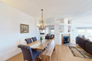 a dining room and living room with a table and chairs at Nonpariel Escape in Paso Robles
