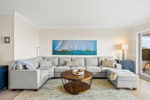 a living room with a couch and a table at Beach Retreat in Santa Barbara