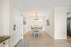 a kitchen and dining room with a table and chairs at Beach Retreat in Santa Barbara