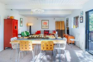 a living room with a table and chairs and a couch at The Silver Lady in Cambria