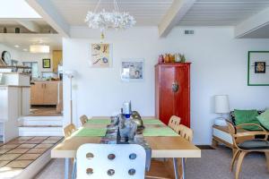 a kitchen and dining room with a table and chairs at The Silver Lady in Cambria +19 photos