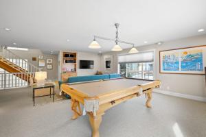 a living room with a pool table in it at Sand Side Bliss in Oxnard