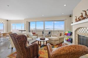 a living room filled with furniture and a fireplace at Sand Side Bliss in Oxnard