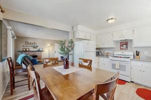 a kitchen and dining room with a wooden table at Ramona Memories in Grover Beach