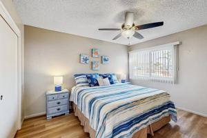 a bedroom with a bed and a ceiling fan at Ramona Memories in Grover Beach +6 photos
