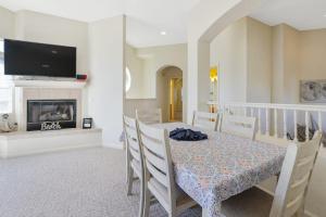 a dining room with a table and a fireplace at Santo Tomas Getaway in Grover Beach +29 photos