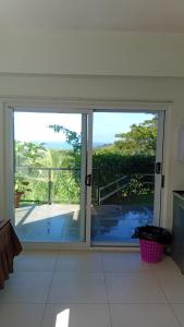 a sliding glass door with a view of a patio at Sunview in Savusavu