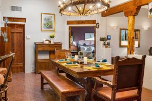a dining room with a wooden table and chairs at Cereus Vista in Tucson