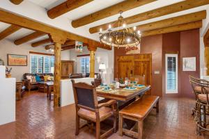 a dining room and living room with a table and chairs at Cereus Vista in Tucson