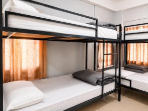 a bunk bed room with two bunk beds at Hi Hostels Shillong in Shillong