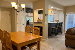 a dining room and kitchen with a table and chairs at Vistoso Resort Casita #163 in Oro Valley