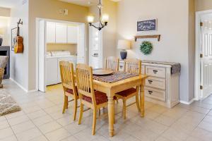 a dining room with a wooden table and chairs at Vistoso Resort Casita #163 in Oro Valley +25 photos