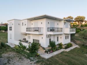an aerial view of a white house at Dëshira Apartments in Ulcinj