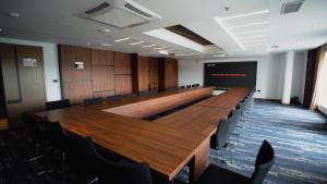 a large conference room with a long table and chairs at Palace Hotel & SPA in Mitrovica +72 photos