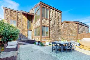 a brick house with a table in front of it at Monterey Dune Dream in Moss Landing
