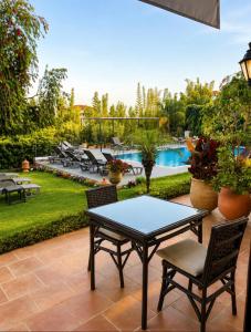 a patio with a table and chairs and a pool at Dar Tanja in Tangier