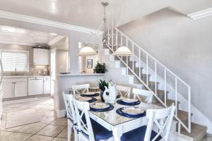 a kitchen and dining room with a table and chairs at San Clemente - Monterey Fourplex in San Clemente